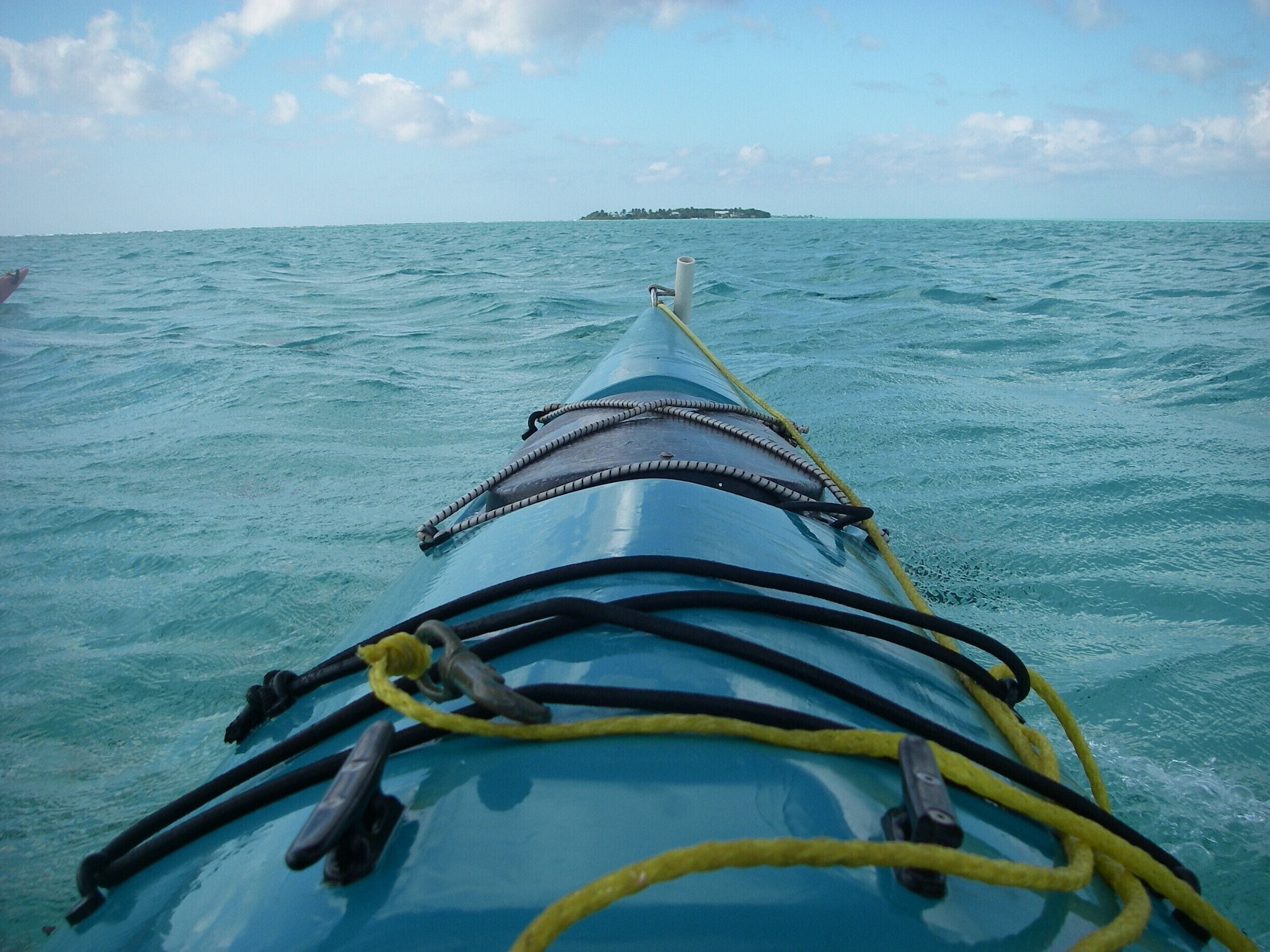 Kayaking between islands in the atoll of Glover's Reef, 40 miles or so off the coast of Belize. Off-grid and out of this world!