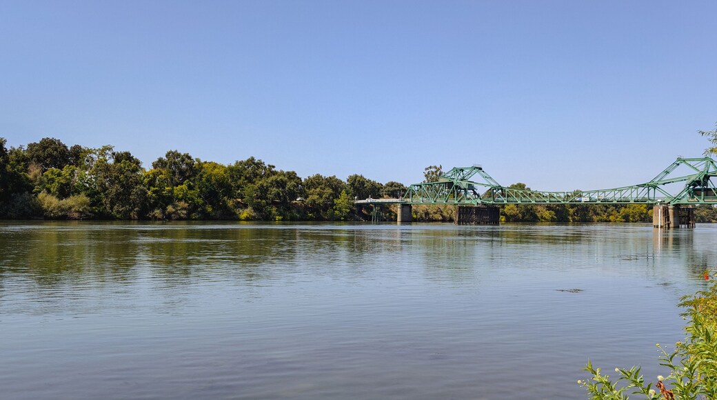 Panorama of a green drawbridge over sacramento river