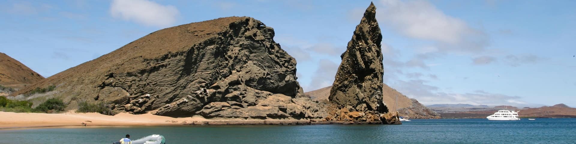 Bartolome Island featuring boating, general coastal views and rocky coastline