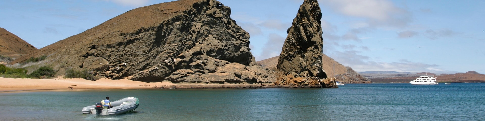 Bartolome Island featuring boating, general coastal views and rocky coastline