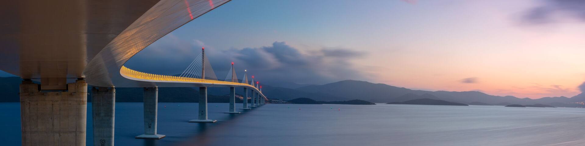 Peljesac Bridge, Croatia. Panoramic image of beautiful modern multi-span cable-stayed Peljesac Bridge over the sea in Dubrovnik-Neretva County, Croatia at sunset.
