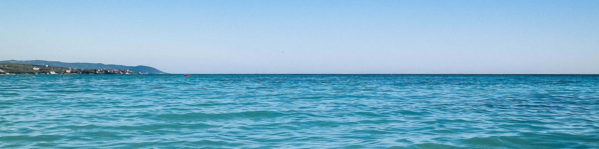 Blue water of Tyrrhenian sea in Vada, Tuscany, Italy.