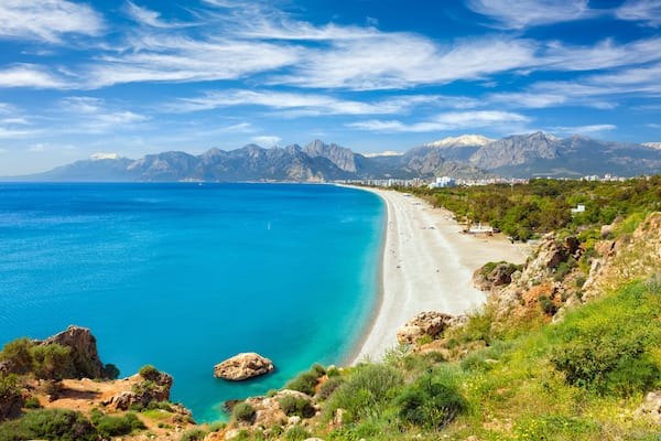 Aerial view of beautiful blue gulf and long Konyaalti beach in Antalya, Turkey.