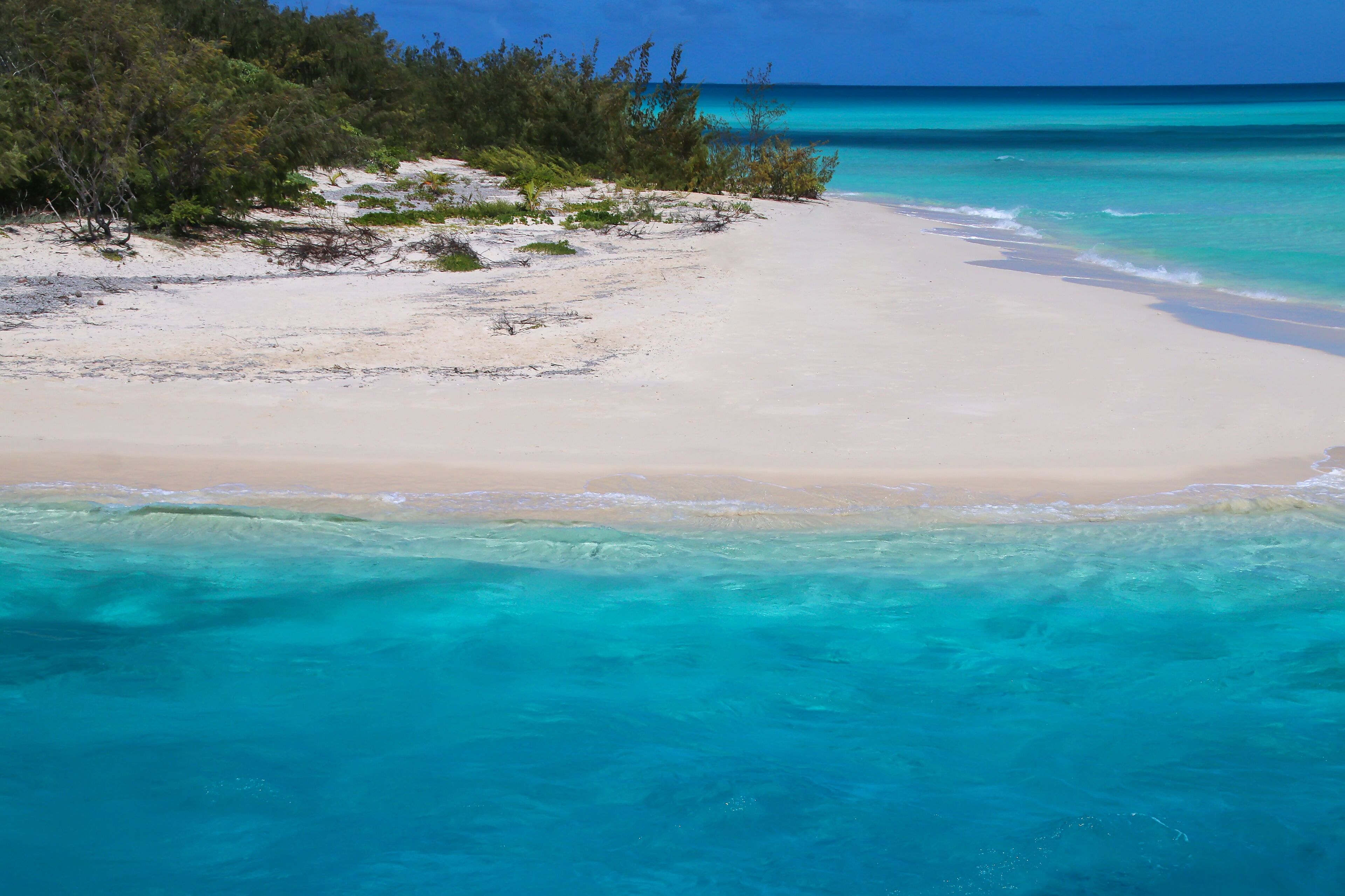 Sandy beach on the shore of Ouvea Lagoon, Mouli Island, Loyalty Islands, New Caledonia.