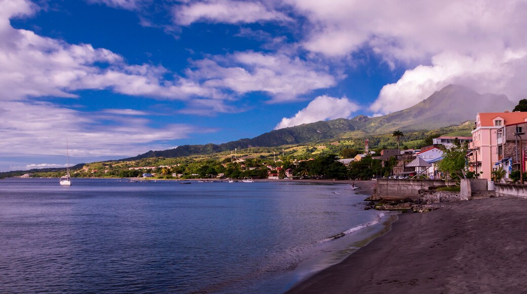View of Saint-Pierre on Martinique island and Mount Pelee volcano at sunset