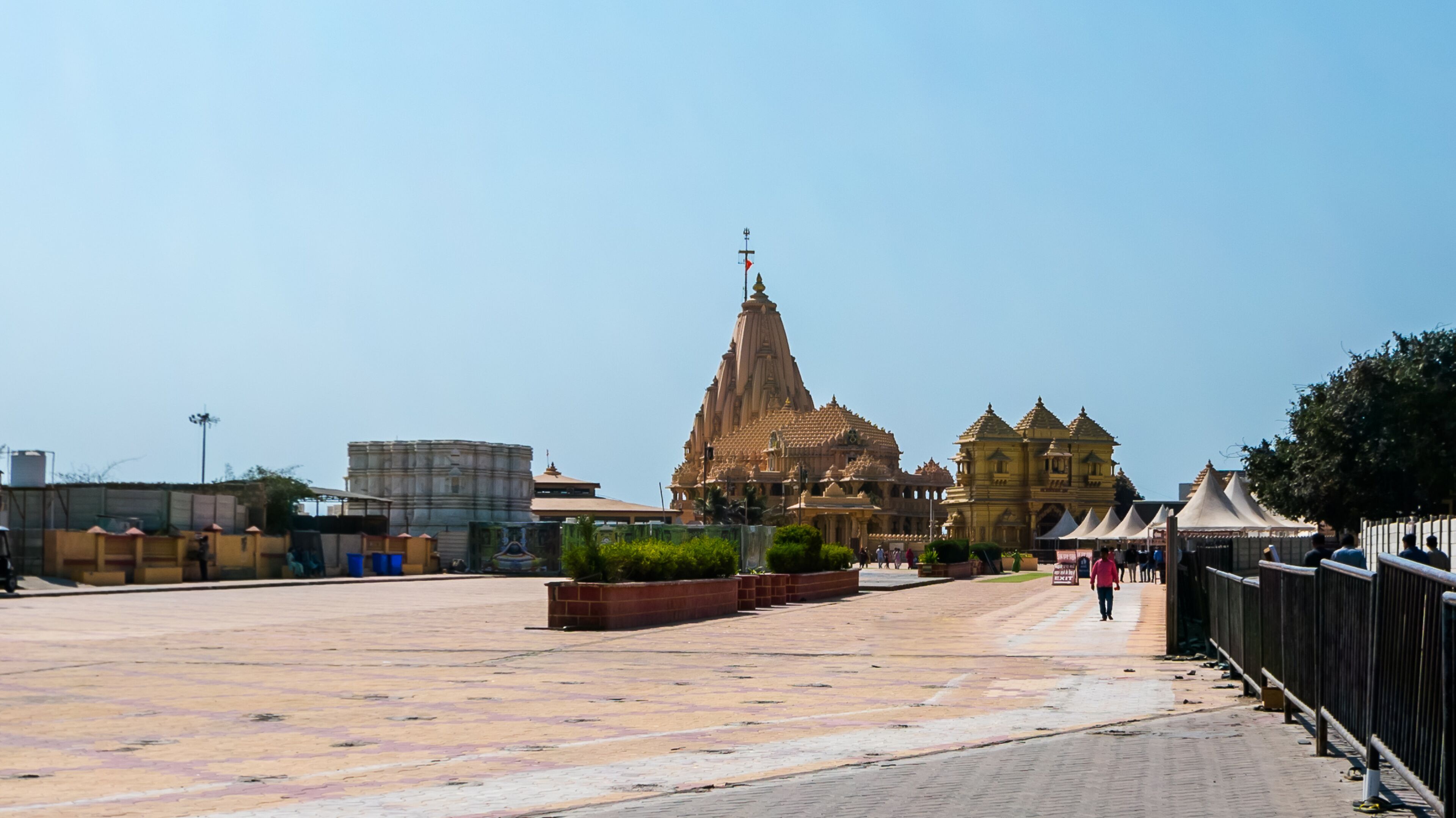 A temple complex with a large central spire and smaller surrounding structures.