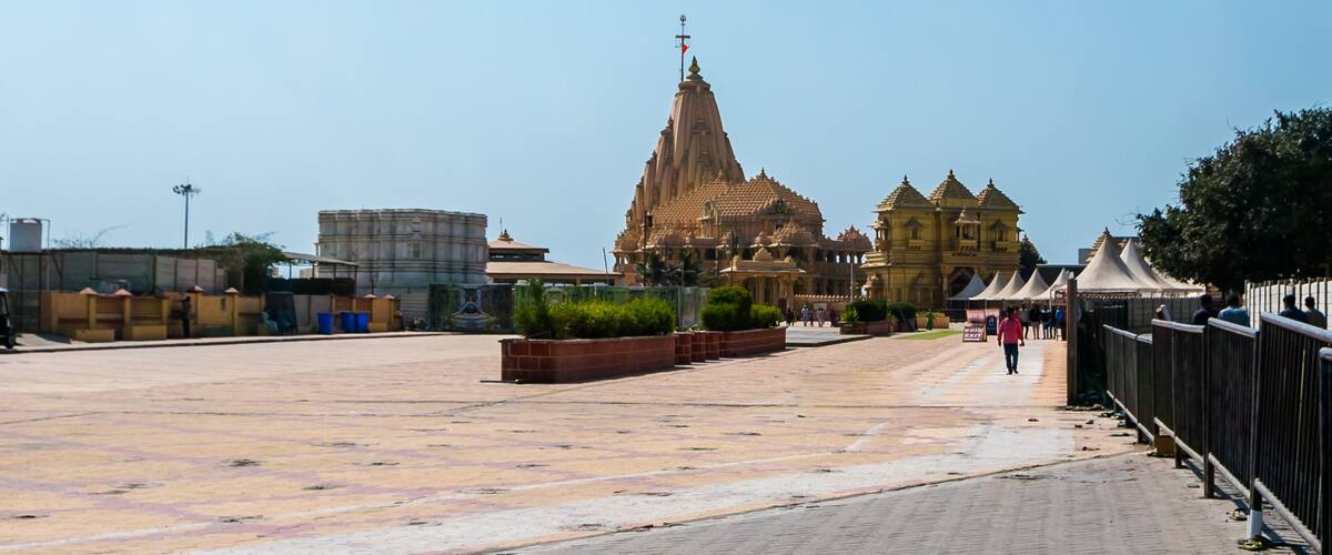 A temple complex with a large central spire and smaller surrounding structures.