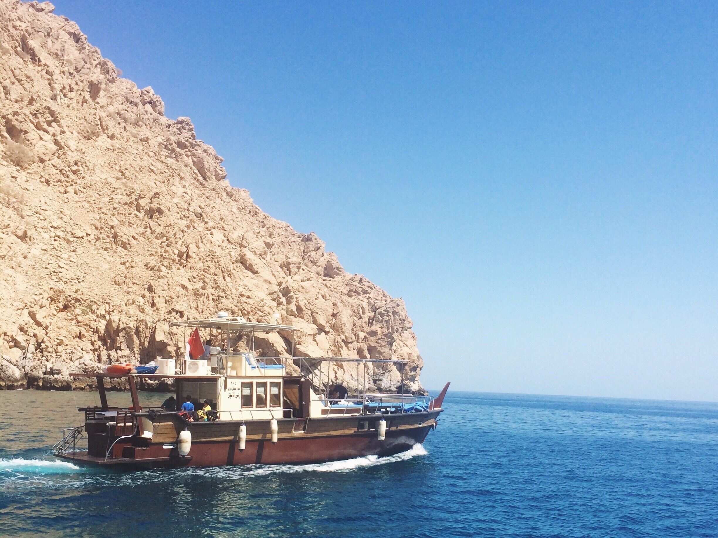 #TroveOn

Just a 2-hr bus ride from Dubai, travellers residing or vacationing in UAE can escape its busy cities and hop on another country without breaking a sweat (and a bank!). Musandam sits just a few yards outside UAE's borders. Permits can be acquired easily by booking through travel agencies abundant in Dubai (or any other emirate). Trade the palm tree views to a more unique mountain boulder surroundings, cruise along the persian gulf and jumped off the boat and straight to Musandam's #blue waters. 

