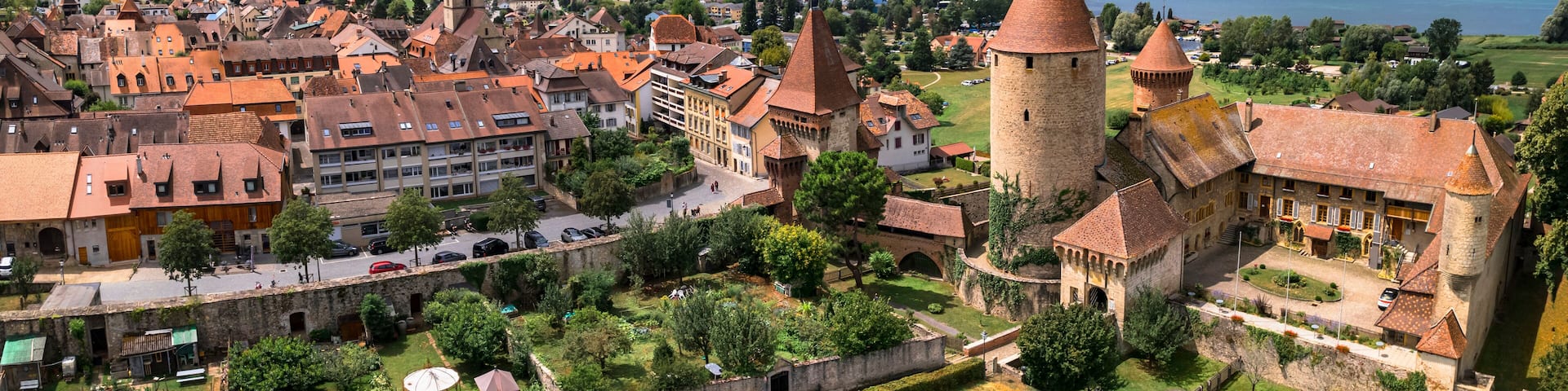 Switzerland scenic places. Estavayer-le-lac - charming traditional village, lake Neuchatel. aerial drone video of medieval castle. Canton Fribourg.