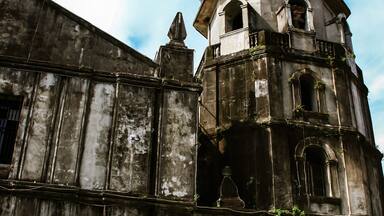 The belfry of Our Lady of Candelaria Parish Church in Silang, Spanish colonial style, first built in 1585, Cavite Province, Luzon island, Philippines. National Cultural Treasure.