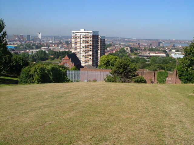 River Mersey from Everton Park. Prominent buildings in this view are St Polycarp's Church on Netherfield Road and, further away, St Anthony's Church on Scotland Road, either side of the block of flats on Conway Street. The Mersey can be seen between the buildings of Vauxhall.