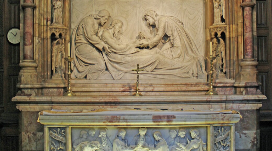 Marble altar to St Joseph showing in relief, his death surrounded by supplicants for his soul.