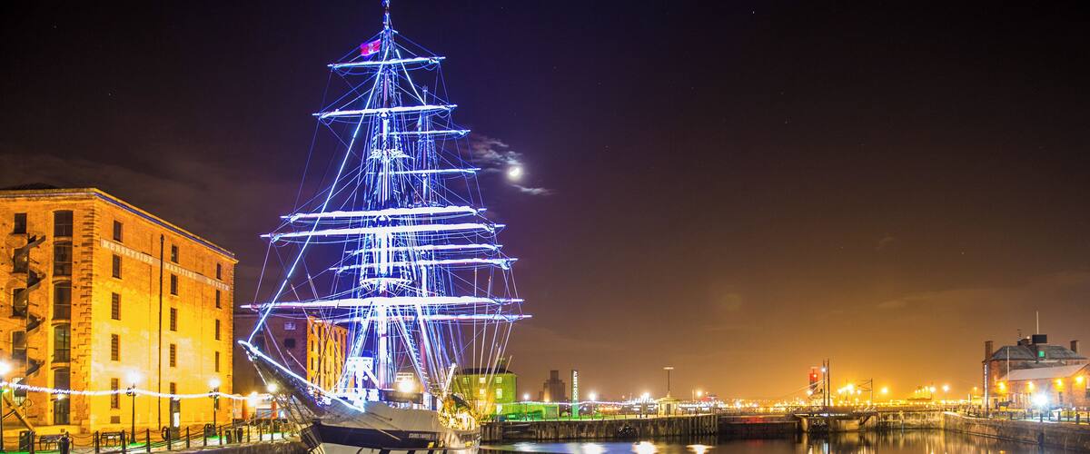 Illuminated brig-rigged tall ship "Stavros S Niarchos" in Albert Dock, Liverpool on Dec 27, 2014