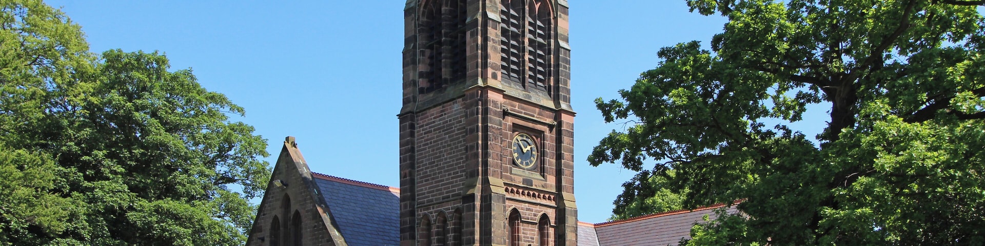 Grade II listed church, 1839, in Halewood, Knowsley, Merseyside. Difficult to view the whole of the frontage, and this is the most complete view you'll get.