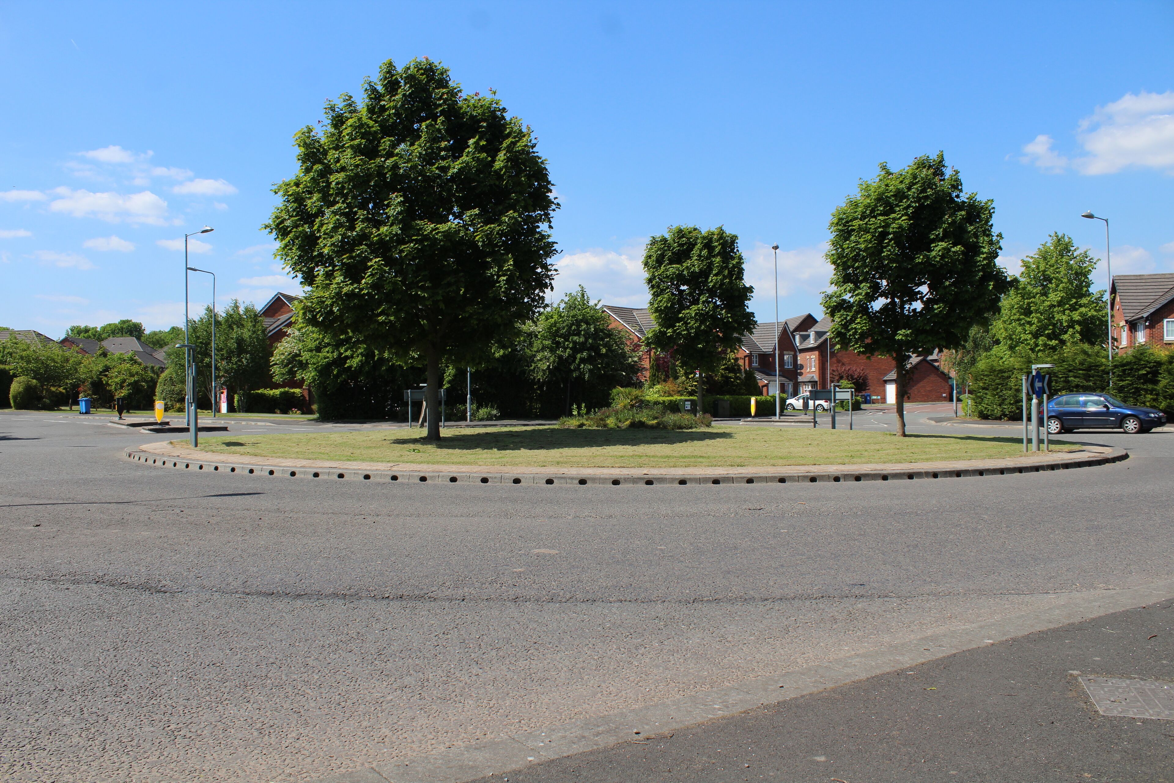 Roundabout giving access to a modern housing estate at the northeast corner of Halewood.