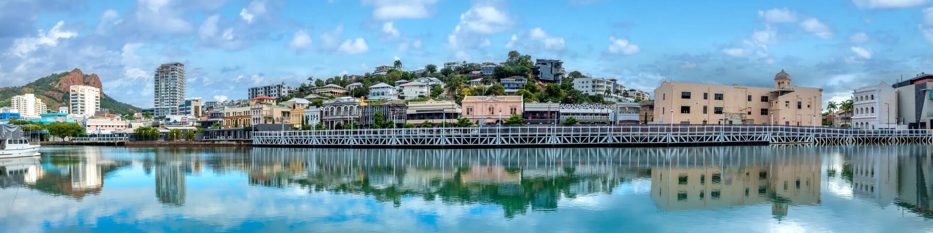 Panoramic view of the water front of Twonsville CBD with the iconic Castle Hill in the background, Queensland, Australia