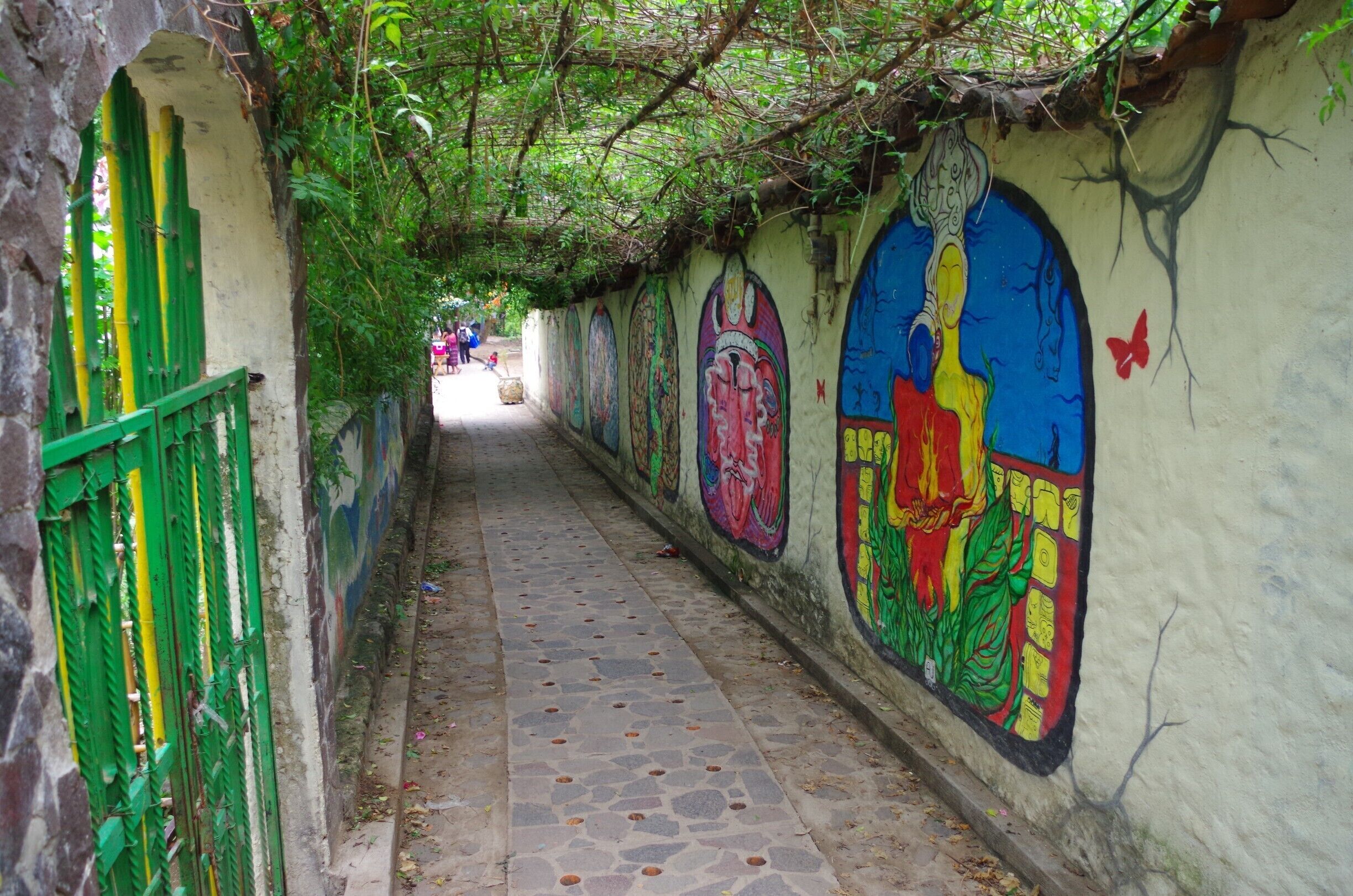 Walk way from boat dock into village. There are several murals along this walkway. Beautiful paintings!  Have a drink at the bar on the right side of dock and watch the boats arrive/leave.