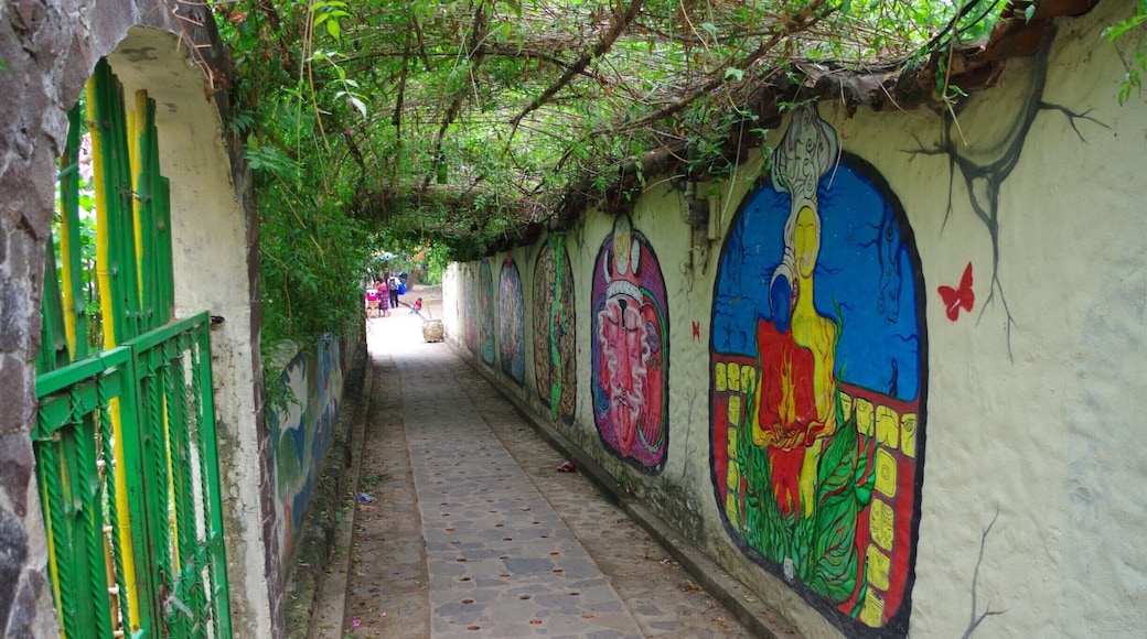 Walk way from boat dock into village. There are several murals along this walkway. Beautiful paintings! Have a drink at the bar on the right side of dock and watch the boats arrive/leave.