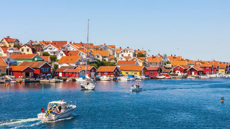 A harbor with colorful houses and boats.