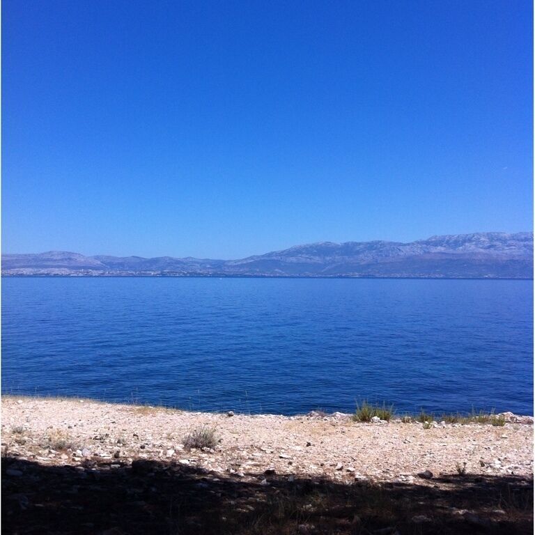 Beach with view on Split, not crowded, pine forest, shade, windy, nudism welcome