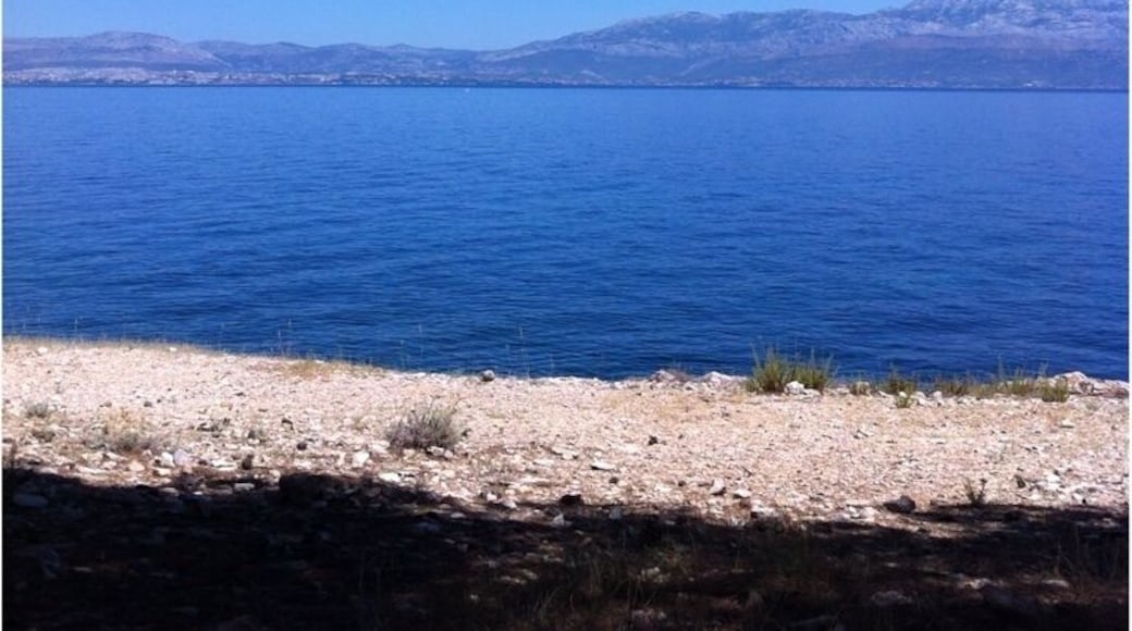 Beach with view on Split, not crowded, pine forest, shade, windy, nudism welcome