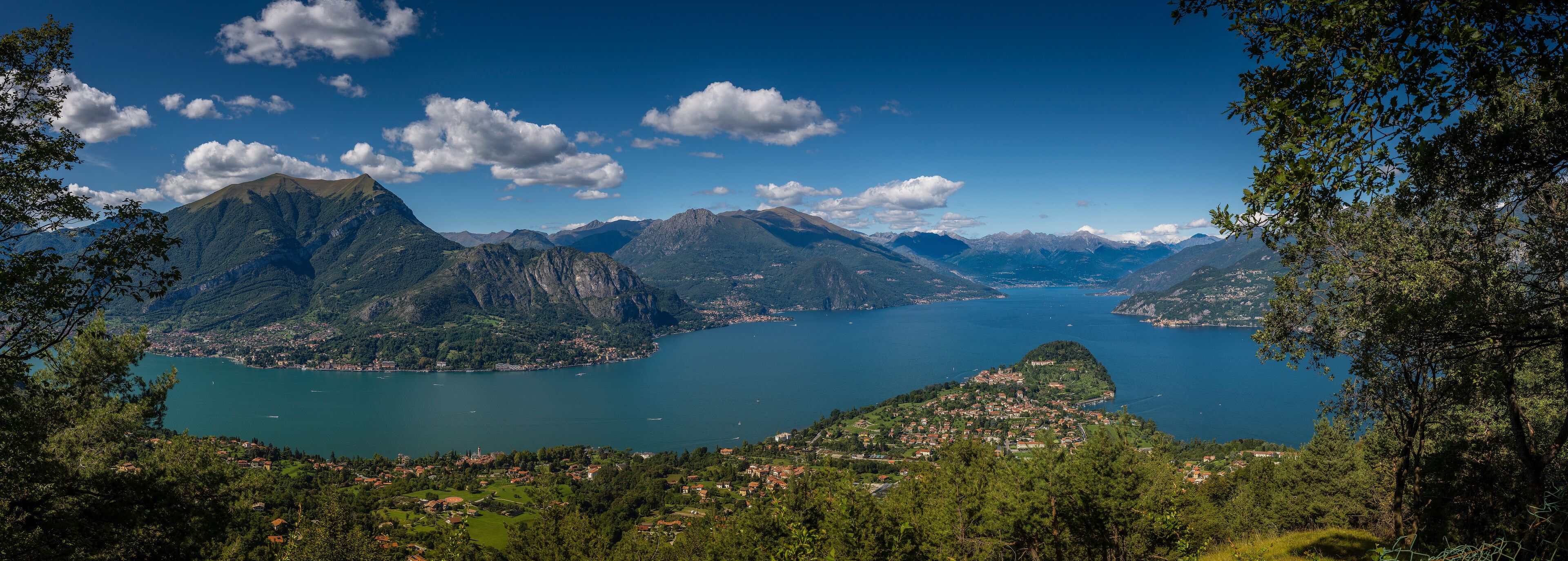 A mountainous landscape with a lake and a town.