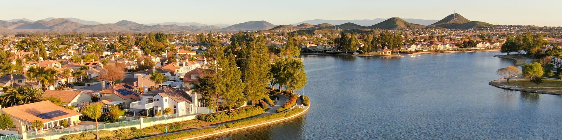 Aerial view of Menifee Lake and neighborhood, residential subdivision vila during sunset. Riverside County, California, United States