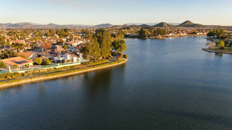 Aerial view of Menifee Lake and neighborhood, residential subdivision vila during sunset. Riverside County, California, United States