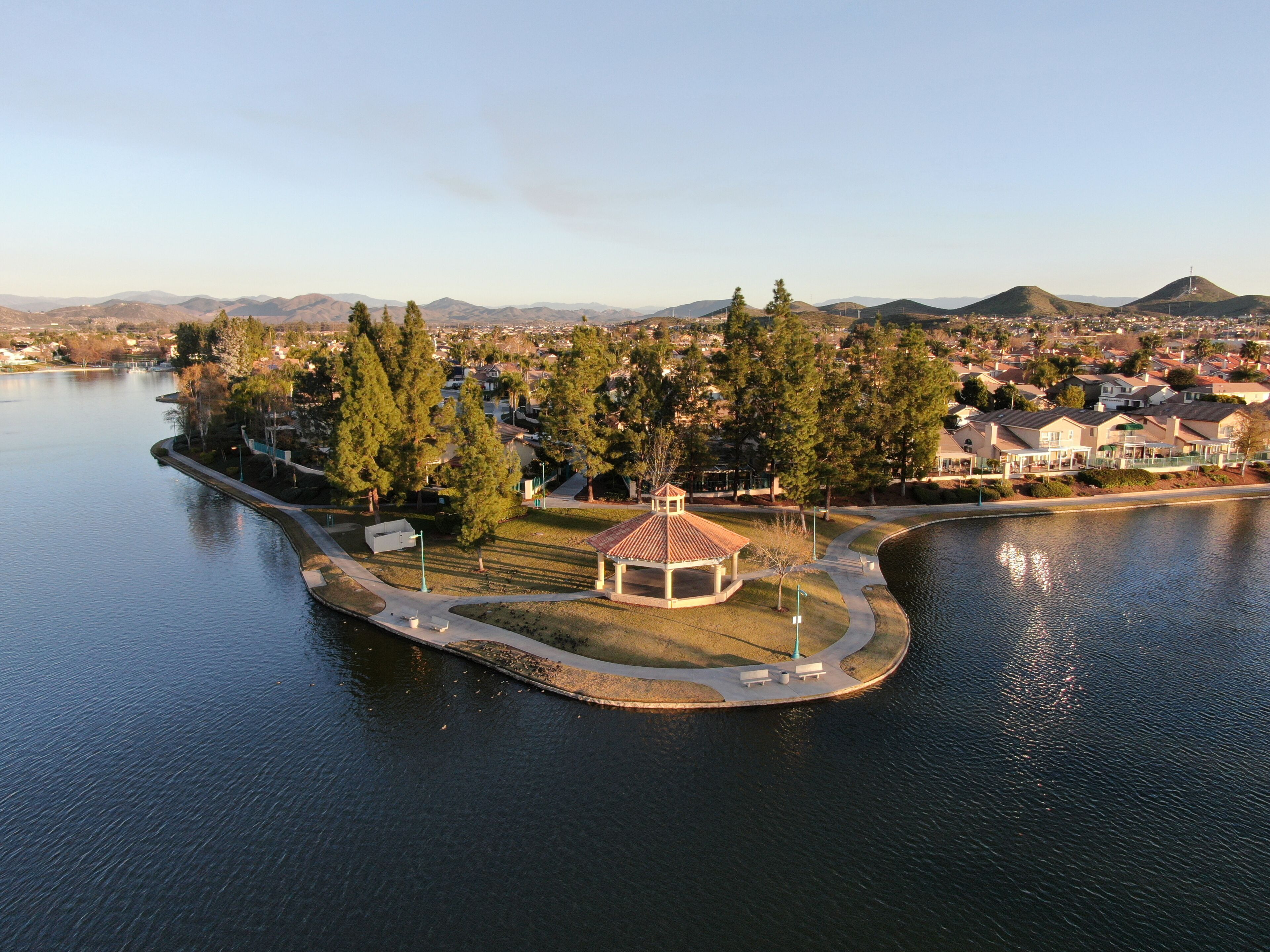 Aerial view of Menifee Lake and neighborhood, residential subdivision vila during sunset. Riverside County, California, United States