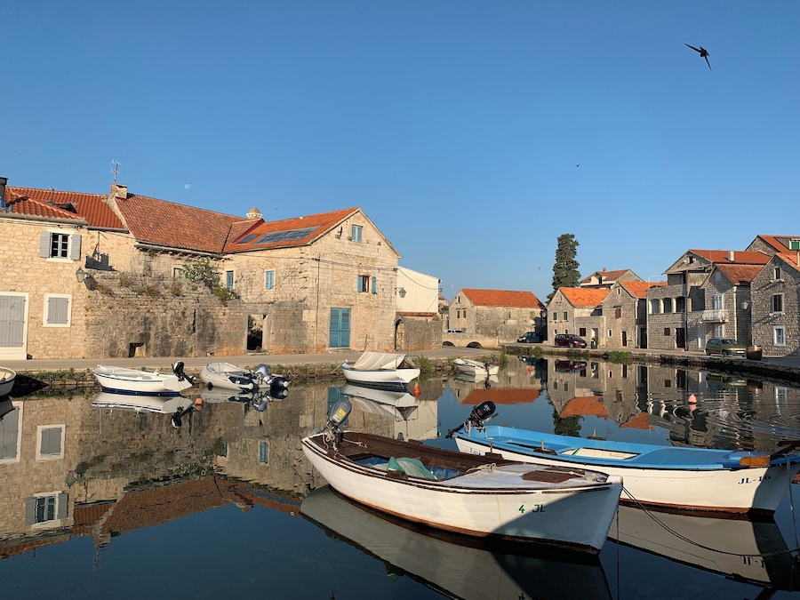 The beautiful canals of the fisherman’s village Vrboska on the island Hvar in Croatia. The canals give it the nickname ‘Little Venice’