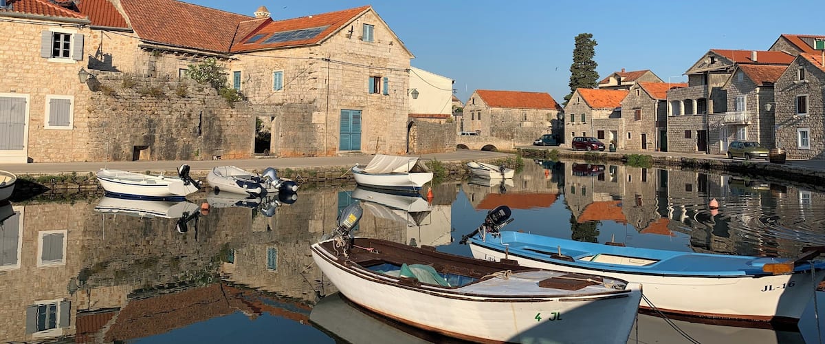 The beautiful canals of the fisherman’s village Vrboska on the island Hvar in Croatia. The canals give it the nickname ‘Little Venice’