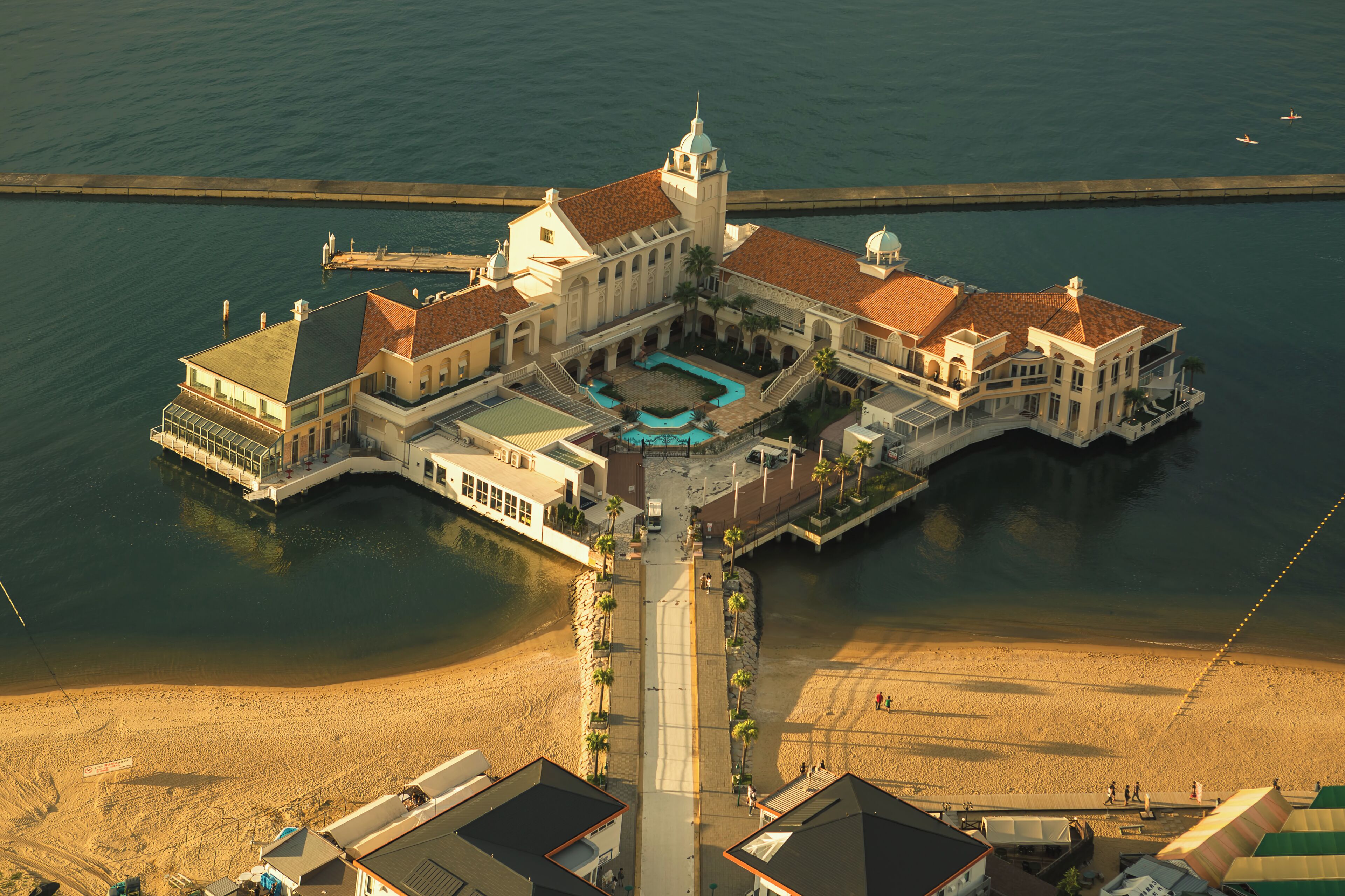 Seaside Momochi (シーサイドももち, Shīsaido Momochi) is Fukuoka's modern waterfront located on reclaimed land along Hakata Bay. The area was originally developed as the site of the 1989 Asia Pacific Expo and is now home to several attractive amusements including beaches, museums and a variety of shopping and dining options centered around Fukuoka Tower.
.
Momochihama Seaside Park is a one kilometer long stretch of artificial beach at the foot of Fukuoka Tower. At the center of the beach is Marizon, an artificial island featuring restaurants, shops, a wedding hall, and a ferry port with connections to Uminonakamichi Seaside Park across Hakata Bay. The beach is also a popular spot for swimming and sports such as volleyball and soccer.
.
Probably one of the best views to see the whole expanse of the beach (as well as a 360degree view of the city) would be from atop the Fukuoka Tower observation deck, 123m above ground. I highly recommend going there before sunset right before it gets crowded to appreciate the view during daytime and golden hour, then stay until evening to witness the blue hour and night view of the whole city. Once back on the ground and outside of the tower, don’t miss the building’s light illumination show which changes every few weeks and on special occasions.