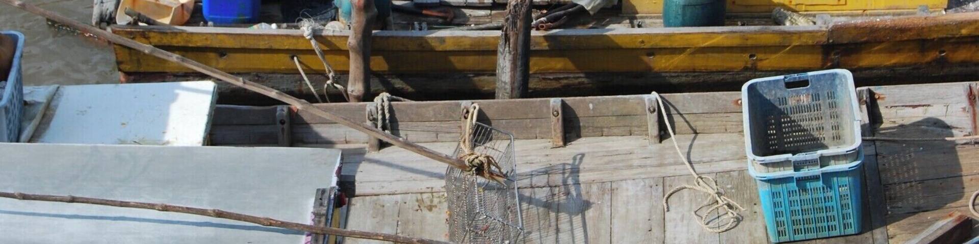This sleepy fishing village is a really cool place to see. Near the tiny market in the middle of the village is a concrete walking/scooter bridge that crosses the river. This is where I took this photo and is the best place to see the heart of the village.