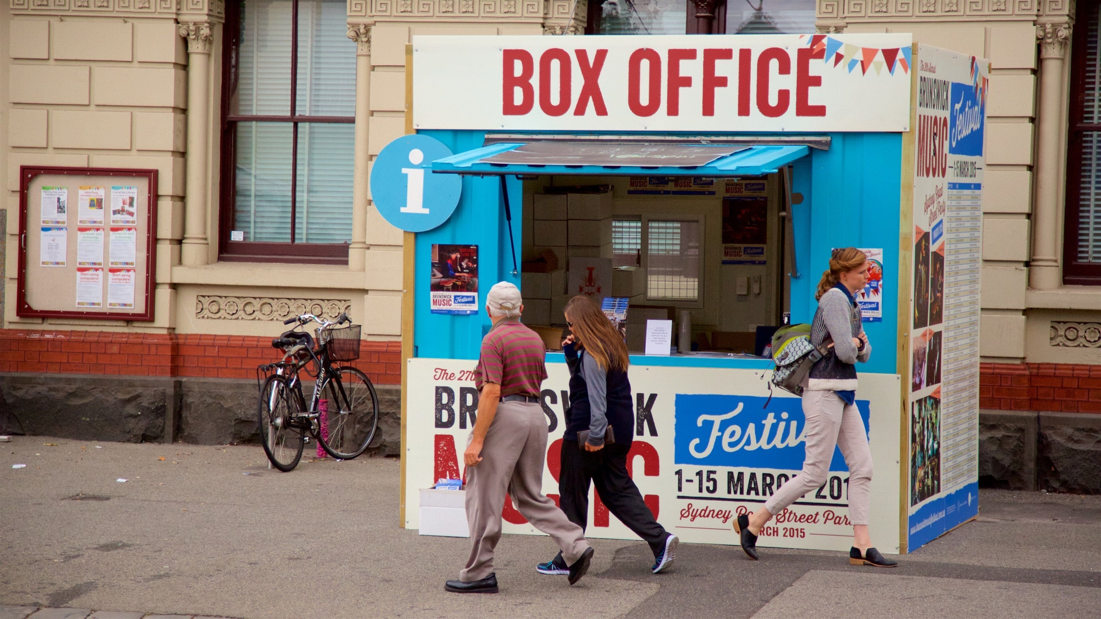 Brunswick showing signage as well as a small group of people