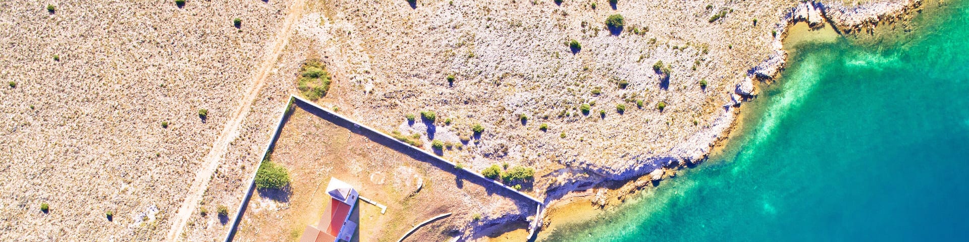 Aerial view of Zecevo island church and beach near Vrsi