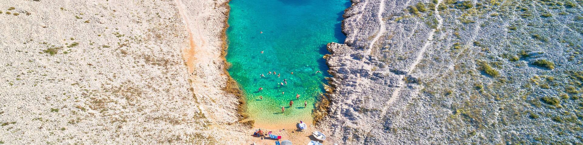 Vrsi. Zadar archipelago idyllic cove beach in stone desert scenery near Zecevo island