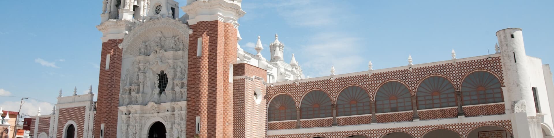 A historic church with two bell towers and a large arched entrance.