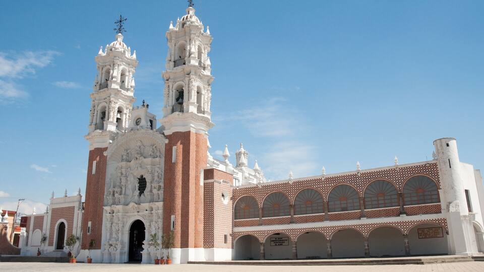 A historic church with two bell towers and a large arched entrance.