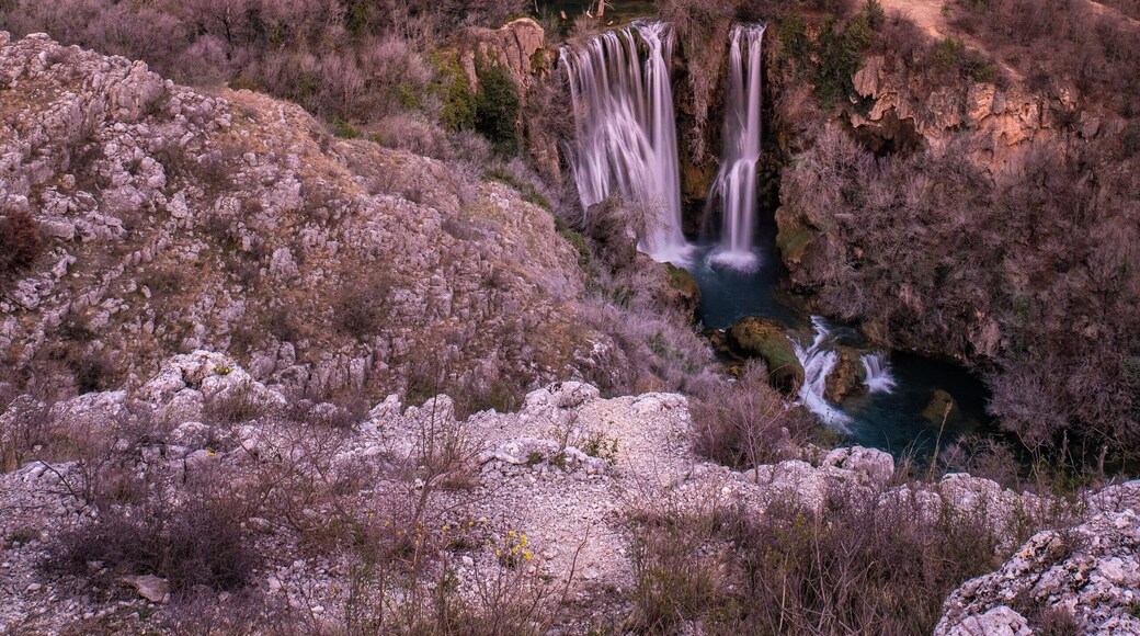 Although this beautiful waterfall belongs to the Krka National Park in Croatia, it's kinda secluded, but well worth the little detour.
The sun was setting in my back and brought some color to the sky when I took this shot.