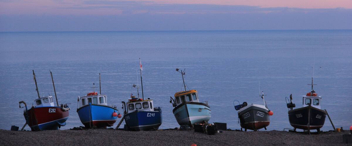 Come to Beer in the afternoon to browse all its little one-of-a-kind art galleries and shops, but make sure you head to the beach at dusk to be treated to views like these 😊
You can actually walk to Beer, along the stunning coastal path from Branscombe.  Read more here:
https://galloparoundtheglobe.com/a-weekend-in-branscombe-devon-the-longest-and-possibly-the-prettiest-village-in-england/