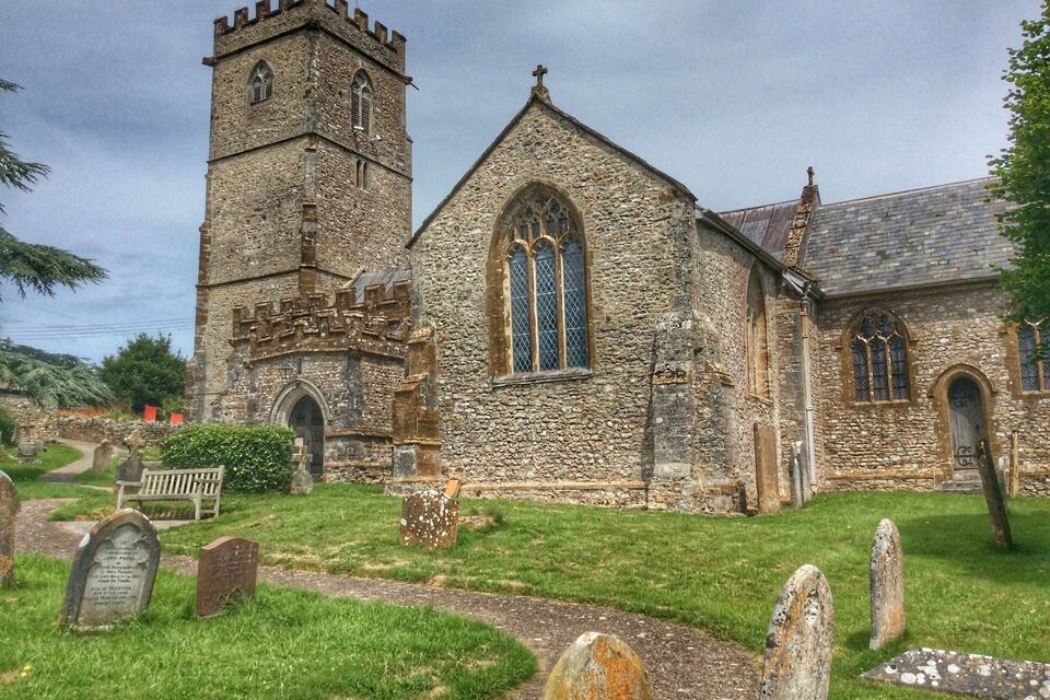 A historic church with a tall tower and stained glass windows.