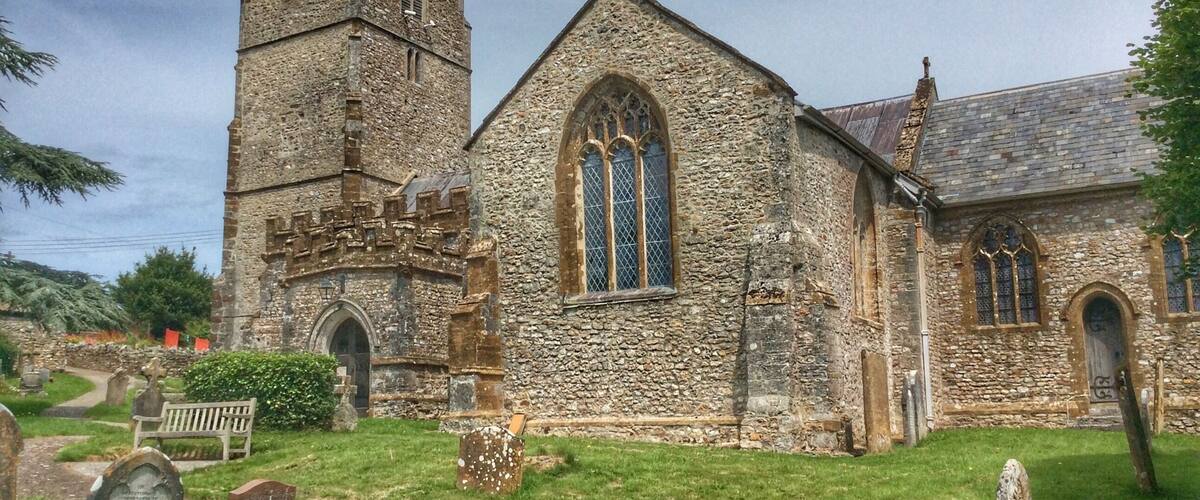 A historic church with a tall tower and stained glass windows.