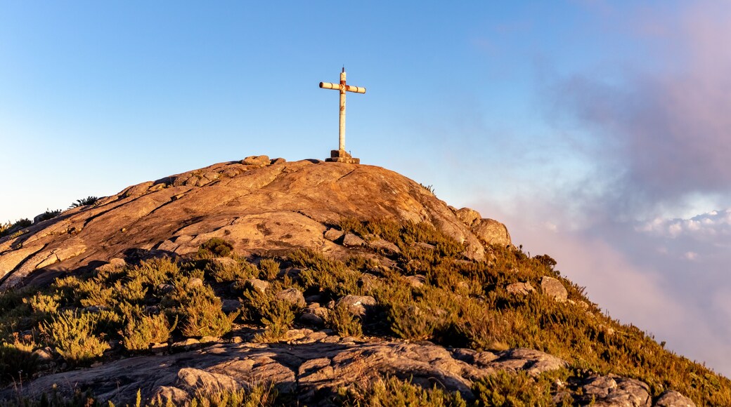 Cross on top of the Bandeira Peak (Pico da Bandeira) at sunset, Caparao National Park, Espirito Santo, Brazil