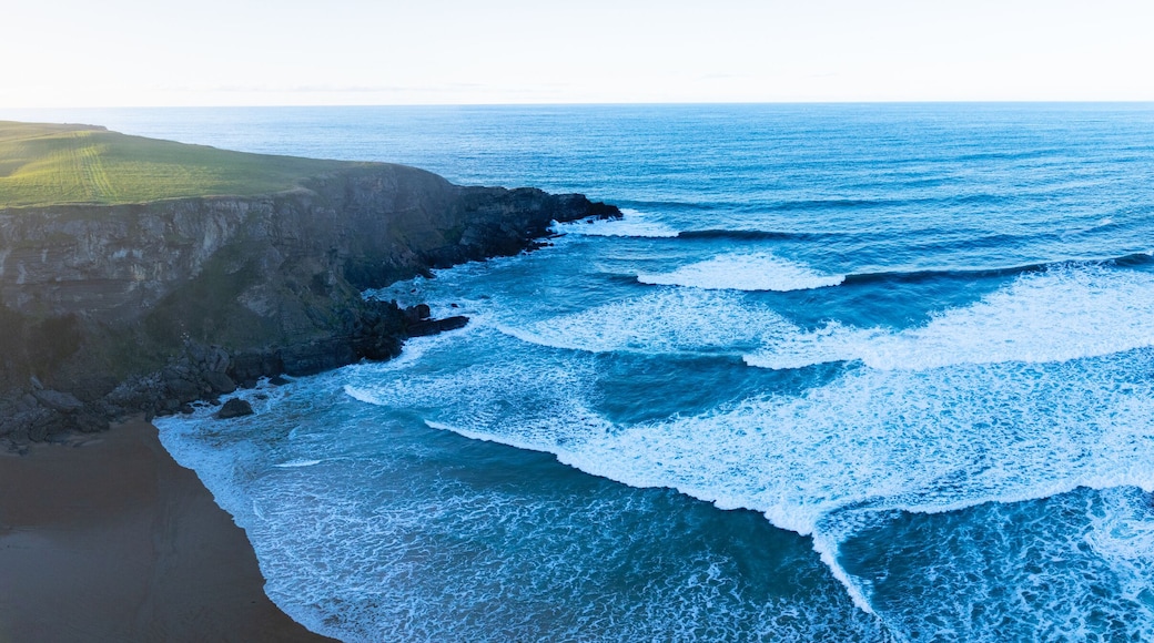 Sunset view from a drone of Antuerta Beach in Ajo, in the municipality of Bareyo, in the autonomous community of Cantabria, Spain. Europe