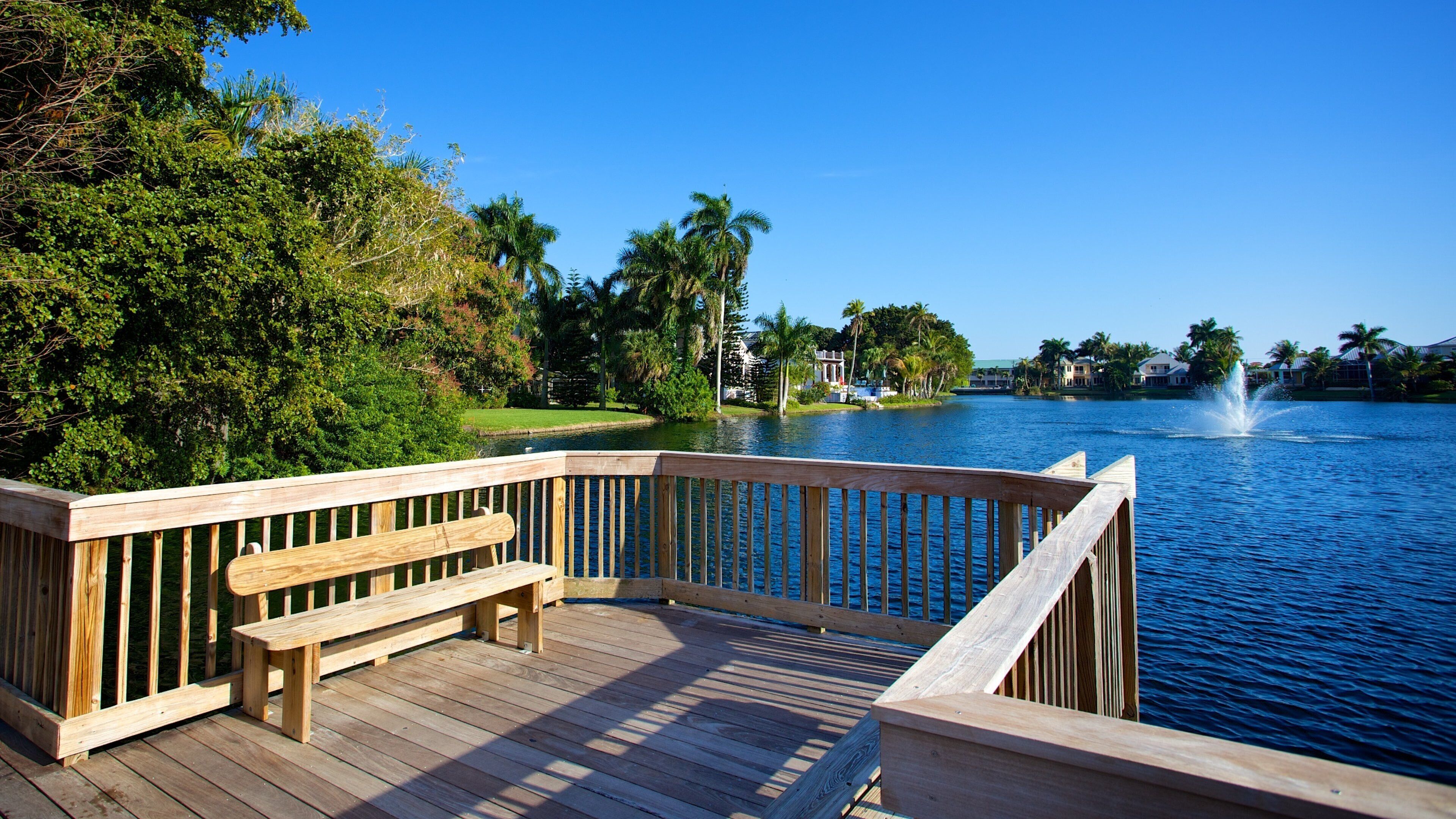 5th Avenue Shopping District showing a lake or waterhole, views and a park