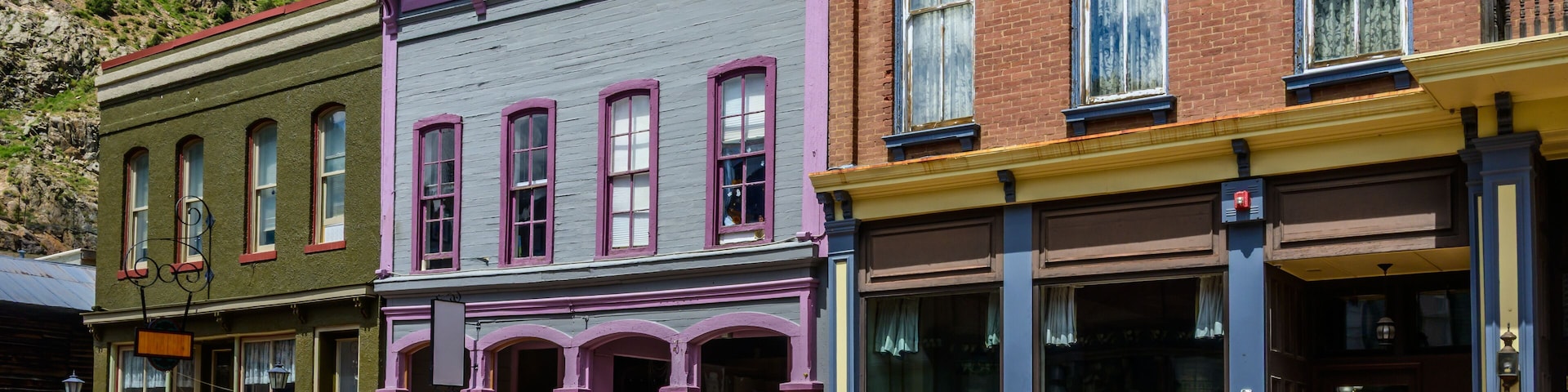 Old brick buildings, once a mining boom town, now a charming tourist destination. The buildings showcase early American architectural styles.