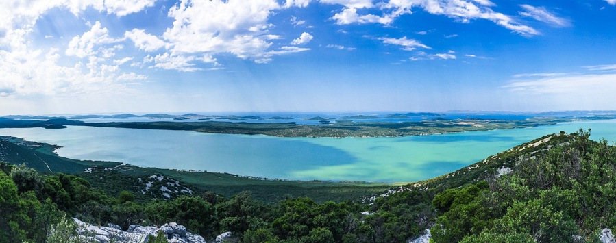 Pano view from Kamenjak of Vransko Jezero and Adriatic sea