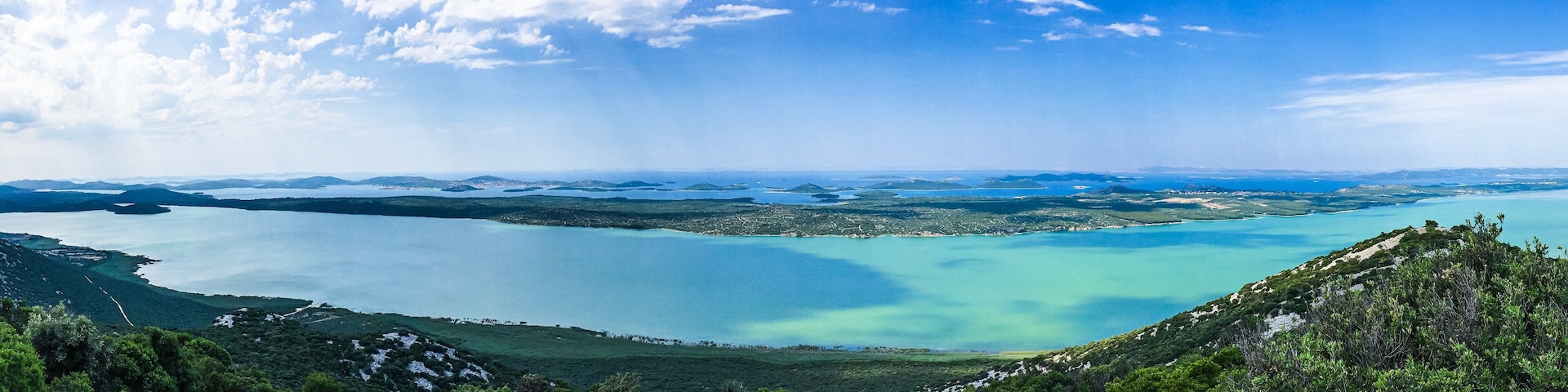 Pano view from Kamenjak of Vransko Jezero and Adriatic sea