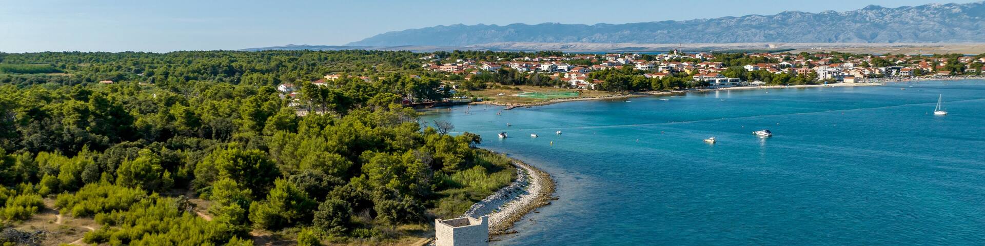 Croatia - The amazing Vir island with an old castle near the sea from drone view