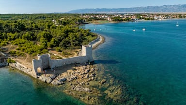 Croatia - The amazing Vir island with an old castle near the sea from drone view